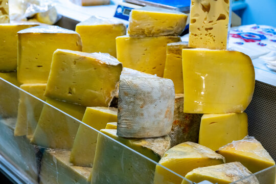 Various Turkish cheese on in diary production market. A lot of kind Turkish cheese  wheels on the shelves in diary production market. Food. Organic fresh chee se  skin and blocks of raw  in stainless 