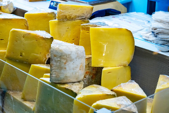 Various Turkish cheese on in diary production market. A lot of kind Turkish cheese  wheels on the shelves in diary production market. Food. Organic fresh chee se  skin and blocks of raw  in stainless 