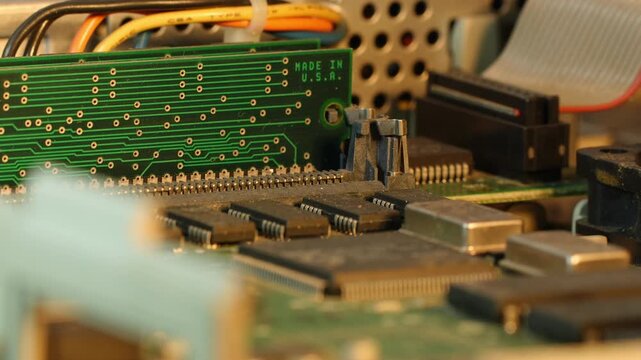 Vintage Computer RAM PCB with Electronic Components Rotating in Macro