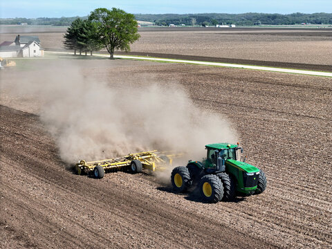 Thomson, Illinois, April 24, 2026, John Deere 9560R tractor pulling a Degelman Pro-Till 36 heavy-duty rotary tillage/soil cuktivator