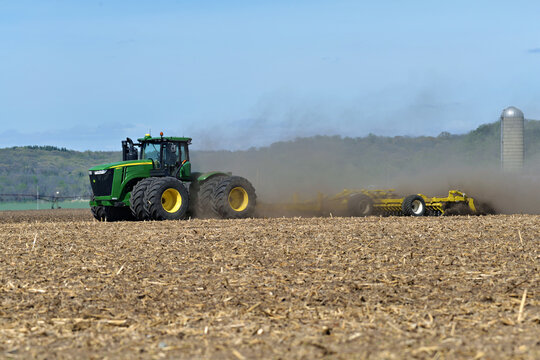 Thomson, Illinois, April 24, 2026, John Deere 9560R tractor pulling a Degelman Pro-Till 36 heavy-duty rotary tillage/soil cuktivator