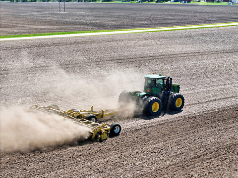 Thomson, Illinois, April 24, 2026, John Deere 9560R tractor pulling a Degelman Pro-Till 36 heavy-duty rotary tillage/soil cuktivator