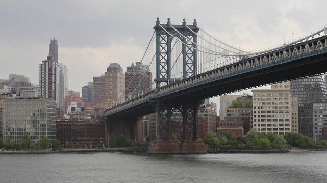 driving in a car down fdr drive in manhattan with view of williamsburg bridge in brooklyn new york city suspension road crossing