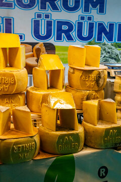 Various Turkish cheese on in diary production market. A lot of kind Turkish cheese  wheels on the shelves in diary production market. Food. Organic fresh chee se  skin and blocks of raw  in stainless 