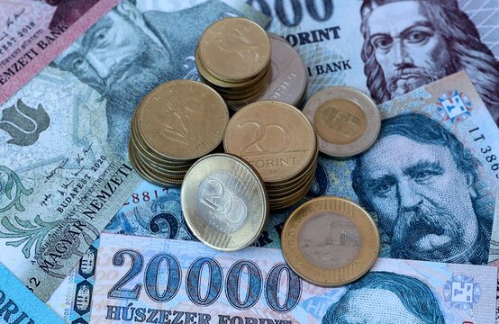 Hungarian forint money banknotes and coins on table. Hungary cash bills of HUF currency