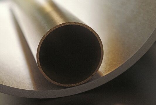 Little tube uot of aluminium lying in great tube, detail