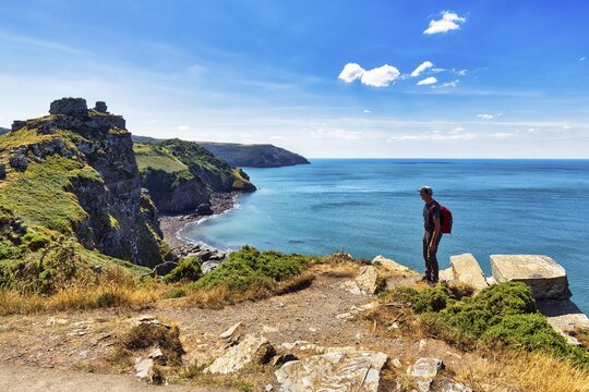 South West Coast Path, walkers on coastal path, Valley of the Rocks, rocky coast in Exmoor National Park, Bristol Channel, near Lynton, Devon, England, United Kingdom