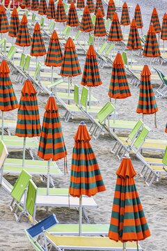 Sunbeds and umbrellas at the beach di Fegina in Monterosso al Mare, Cinque Terre, Ligurian Coast, Liguria, Italy