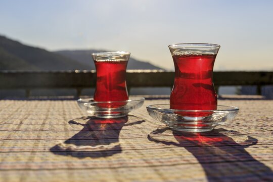 Turkish tea in two glasses on a table, Istanbul Province, Turkey
