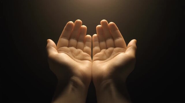 Close-up View of Human Hands in Contemplation Against Dark Background, Symbolizing Faith and Hope