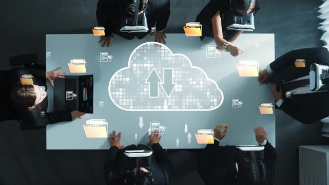 Aerial view of a business team collaborating on cloud technology solutions, emphasizing data exchange and file management in a modern office setting. Raster