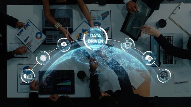 A diverse team collaborates in a modern office setting, focusing on data-driven strategies while leveraging technology and analytics for effective decision-making. Raster