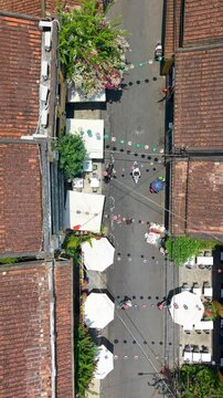 Aerial drone view of Hoi An city, Quang Nam province, Vietnam. Panoramic footage of Ancient town, UNESCO world heritage. One of the most travel popular touristic destinations
