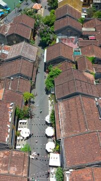 Aerial drone view of Hoi An city, Quang Nam province, Vietnam. Panoramic footage of Ancient town, UNESCO world heritage. One of the most travel popular touristic destinations
