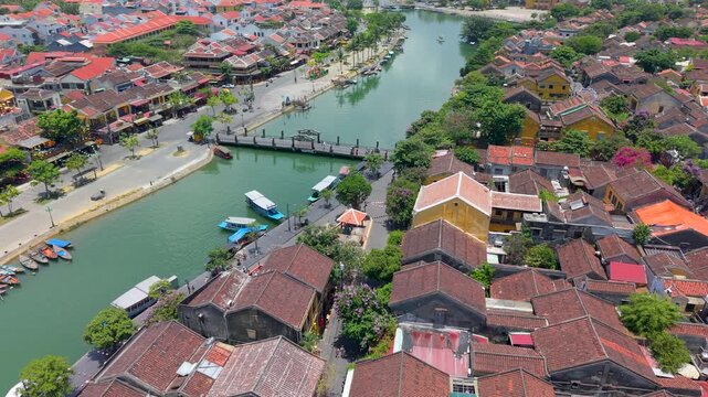 Aerial drone view of Hoi An city, Quang Nam province, Vietnam. Panoramic footage of Ancient town, UNESCO world heritage. One of the most travel popular touristic destinations 