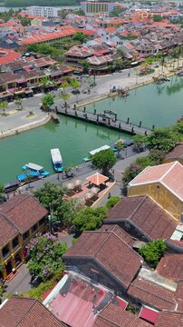 Aerial drone view of Hoi An city, Quang Nam province, Vietnam. Panoramic footage of Ancient town, UNESCO world heritage. One of the most travel popular touristic destinations 