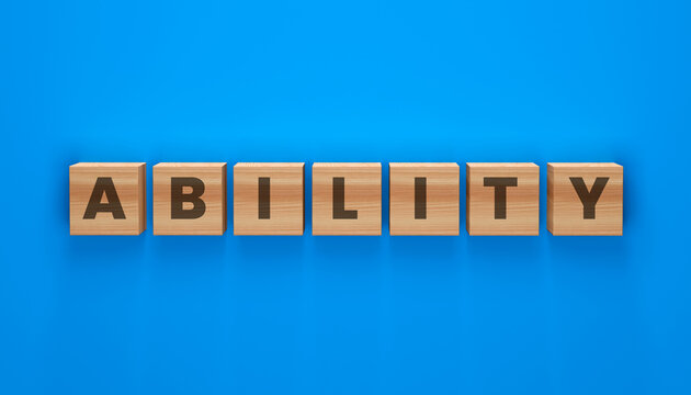 Wooden Blocks Spelling ABILITY: A word spelled out on individual wooden blocks against a vibrant blue background, conveying a message of skill and talent.