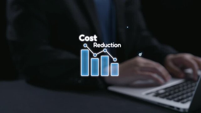 A businessman engages with a laptop displaying cost reduction graphics and financial icons, symbolizing effective budget management and strategic planning in the workplace. Qubit