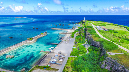 "Aerial View of Cape Henna Lighthouse Surrounded by Turquoise Ocean, Miyako Island, Okinawa" © YUTAKA