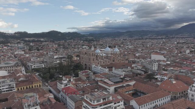 Aerial Drone View of Parque Calder&oacute;n and New Cathedral in Cuenca Ecuador &ndash; Historic City Center. Aerial view featuring colonial architecture, blue domes of the cathedral, surrounding plazas.