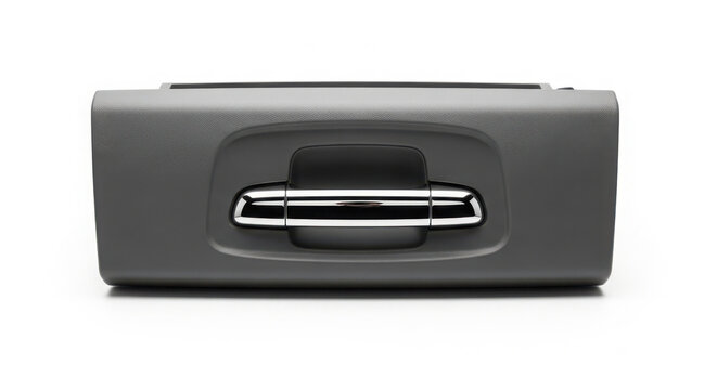 Close up studio photo of an automotive glove box compartment featuring a shiny chrome handle on a textured grey surface