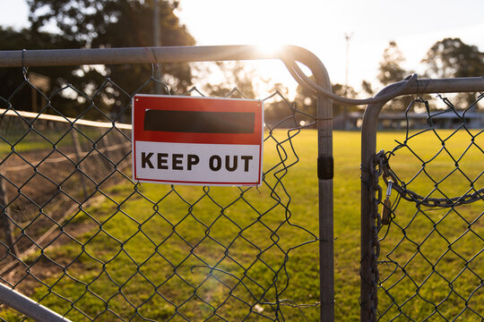 keep out sign on the gate of sports fields