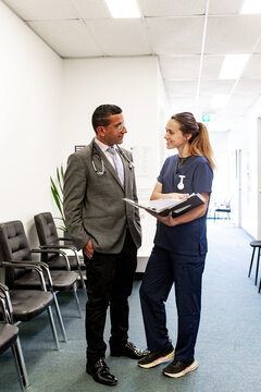 Healthcare professionals discussing patient information