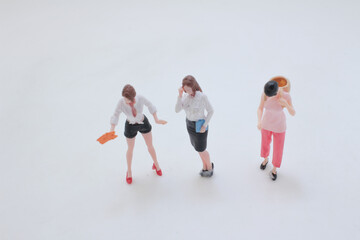 Naklejka premium Miniature people performing daily tasks in group