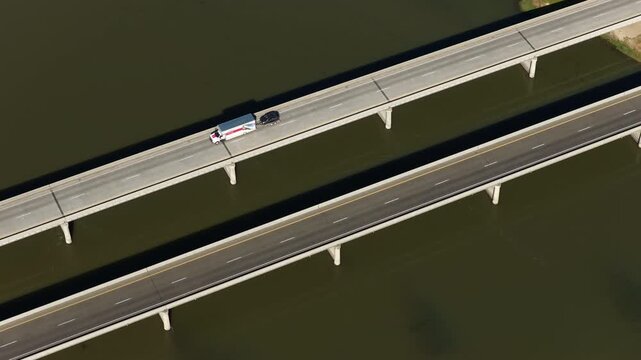 Aerial zoom shot of Interstate 84 over Snake River in Ontario Oregon on sunny day in spring