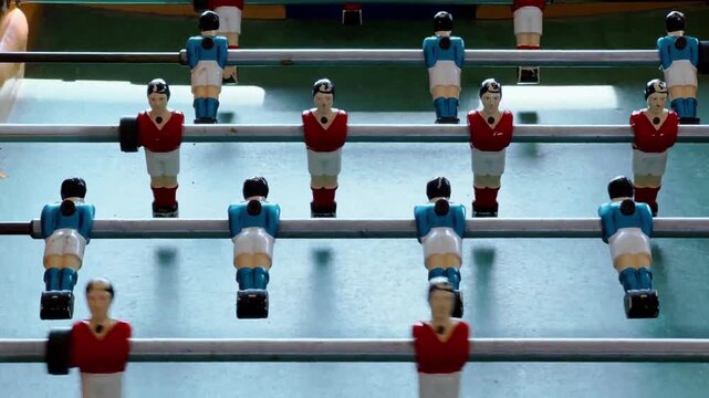 Table Football Figures Spin Hit Ball Foosball Game Tabletop Macro Match Action in 4K Ultra HD footage.
