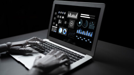 Obraz premium A futuristic robot hand interacts with a laptop displaying complex data visualizations in a dark setting, symbolizing advanced technology and data analysis. Gantry