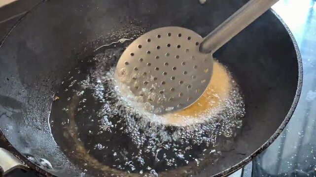 Frying poori in.a pan