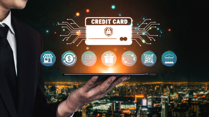 Businessman in Suit Holding Digital Tablet with Credit Card Icons and Financial Technology Graphics...