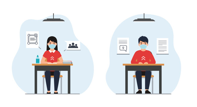 Two students sitting at individual desks in a classroom wearing face masks to maintain safety during social distancing measures.