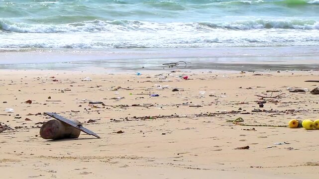 Massive ocean trash pollution covering tropical Patong Beach shoreline during offseason Thailand.