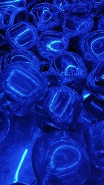 Close Up of Shiny Foil Balloons Moving in Neon Blue Light
