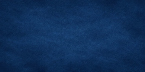 Fototapeta premium Dark blue textured background with subtle gradient effect vector