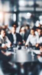 Fototapeta premium Blurred Business Meeting with Diverse Professionals Collaborating Around a Conference Table Indoors
