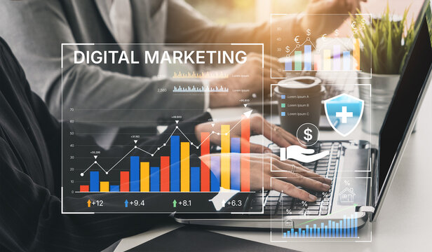 Business professionals analyzing digital marketing trends and data on laptop with financial graphs and charts in modern workspace setting. Bitwise.