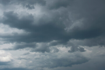 Fototapeta premium Dark cumulus clouds before a spring thunderstorm.