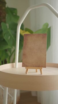 Display of a blank canvas on a small wooden easel