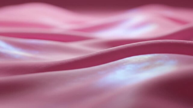 Vibrant pink and purple waves flow across a smooth surface in a dynamic abstract scene.
