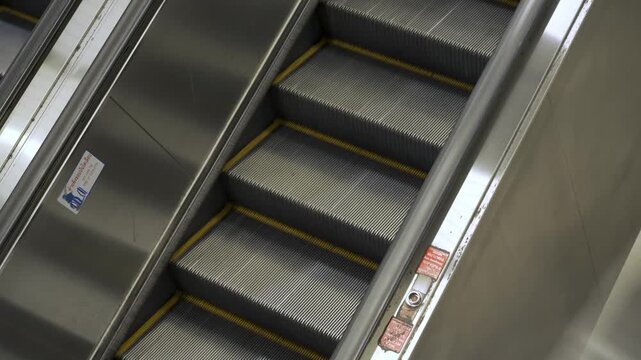 close up view to moving escalator at skytrain subway station , closer look of the escalator on the subway skytrain public transportation going up the upper floor