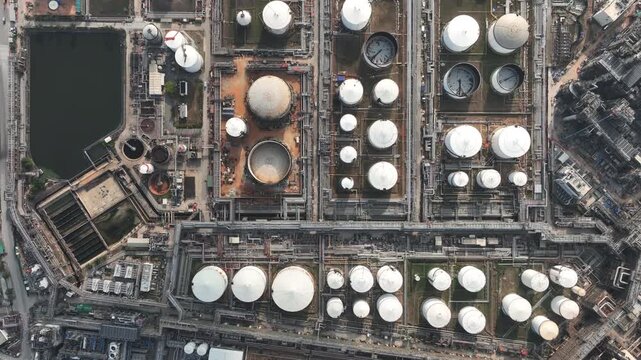 Aerial view white oil storage tank with pipeline steel, Crude oil industry, Storage fuel gas container tank petroleum refinery industrial factory, Oil storage chemical petrochemical refinery product.