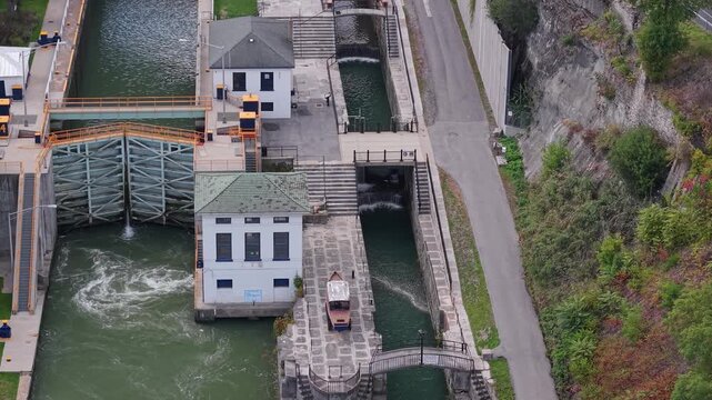Aerial close view of Lockport Locks on Erie Canal in Lockport, New York, USA showing historic canal chambers and water control gates