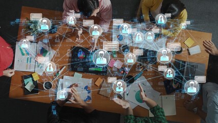 Fototapeta premium Dynamic Collaboration in Digital Workspace with Diverse Teams and Communication Tools Represented on Table Surrounded by Interactive Information Network Sigmoid