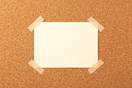 Blank card taped to corkboard