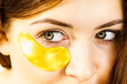 Woman with gold patches under eyes