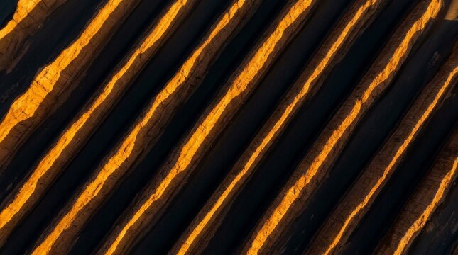 Aerial View of Desert Yardangs with Geometric Shadows at Golden Hour