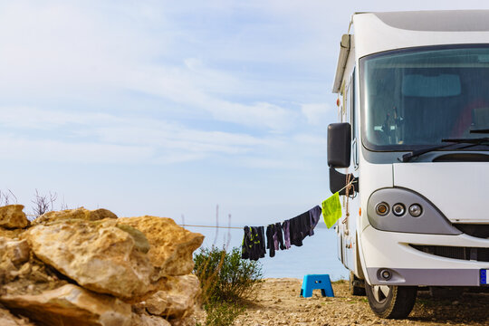 Clothes hanging to dry outdoors at caravan camp on sea shore